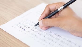 1495651145-closeup-person-filling-out-questionary-form
